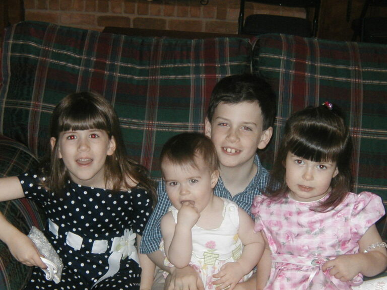 the 4 barnett children on green couch in 2005