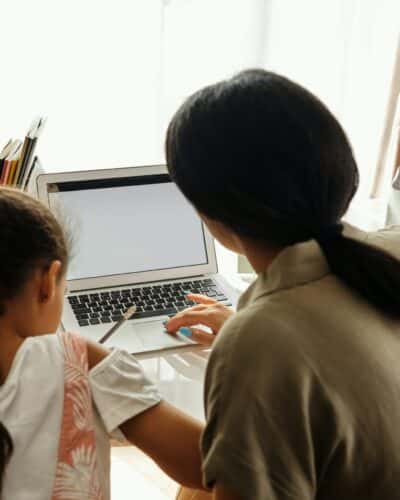 mother and daughter learning with a laptop