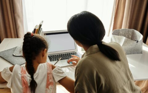 mother and daughter learning with a laptop