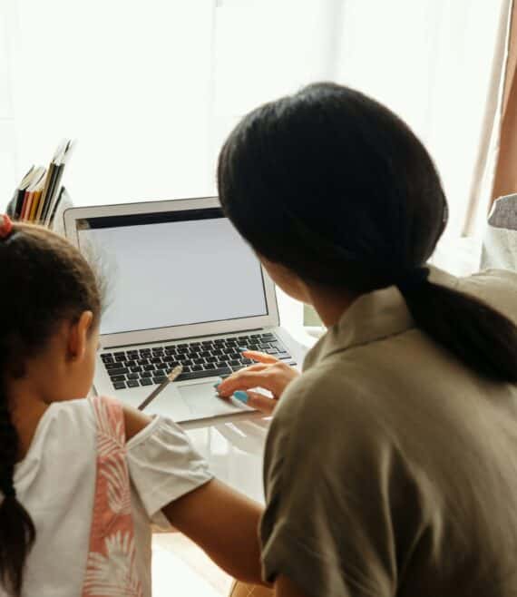 mother and daughter learning with a laptop